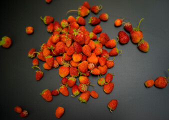 many berries on the table. Strawberry