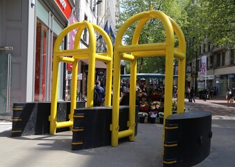 Yellow anti-terror metal barriers protecting lower New Street in Birmingham, England, United...