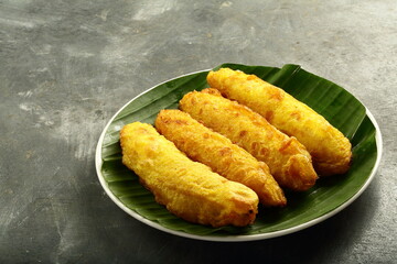 Fried bananas stuffed with coconut and sweets. pazham pori from Kerala traditional kitchen