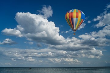 Balloon soars against the blue sky