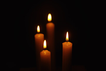 Burning candle Wick from a candle in a flame of fire. Symbol of sadness and loneliness. A time of condolences. Burning wax candle. Religion.