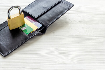 Credit card security concept with lock, wallet on white desk copy space