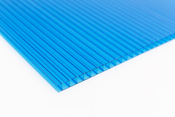 Polycarbonate plastic sheets panels images. PC hollow sheet for translucent roofing close up. Single light blue color on white background