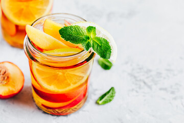 Cold peach and lemon iced tea. Summer refreshing drink