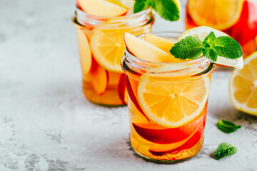Cold peach and lemon iced tea. Summer refreshing drink