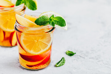 Cold peach and lemon iced tea. Summer refreshing drink