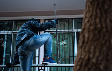 Burglar Robbery or burglary. Climbing the house