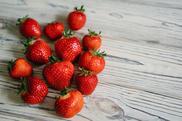 Fresh juicy strawberries organic bio berries in wicker basket on wooden rustic table. Agriculture farmer harvest. concept. Eco, organic vegitarian summer diet food. Selective focus.