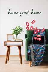 green sofa, blanket, laptop with blank screen and hearts illustration near wooden coffee table with green plant, books, photo frame and home sweet home lettering