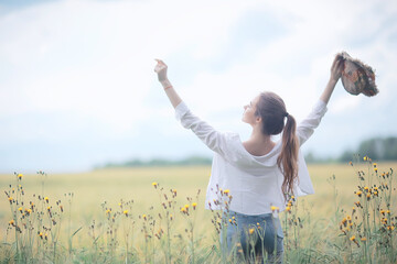 anonymous girl field view from the back / happiness freedom joyful girl mood summer vacation