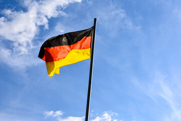 German flag on blue sky in summer day.flag of germany