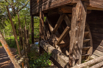 Old wooden water mill wheel. © Т Т