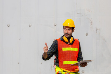 Engineer man holding clipboard checklist with giving thumbs up as sign of success