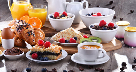 Breakfast served with coffee, juice, croissants and fruits