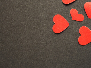 Fototapeta premium Red paper heart shape on black background of your text. The concept for design, wallpaper, love. Top view. .