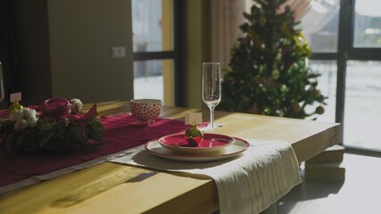 Dolly move of Beautiful Christmas table with Christmas tree on baclgrounds
