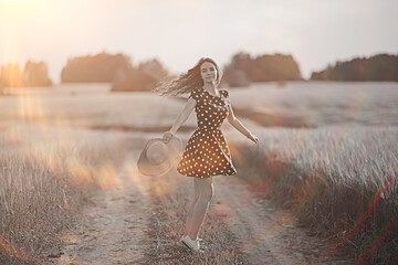 girl dress wheat field / happy summer vacation concept, one model in a sunny field