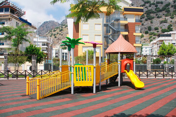 Fototapeta na wymiar Antalya, Turkey, may 20, 2020. Children's Playground on the street with a slide for skiing