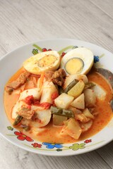 Lontong Sayur Padang, Vegetable Curry with Rice Pressed Cake, Served with Boiled Egg