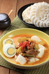 Lontong Sayur Padang, Vegetable Curry with Rice Pressed Cake, Served with Boiled Egg