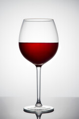 Red wine in a glass on a white background