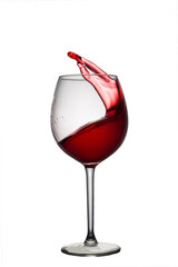 A splash of red wine in a glass on a white background. Healthy wine before dinner