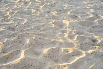 Texture with beach sand at sunset