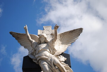 angel statue with blue sky in the background