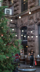 Light bulbs decorate a cafe or a holiday on the street. Stock photo background for design. Urban theme