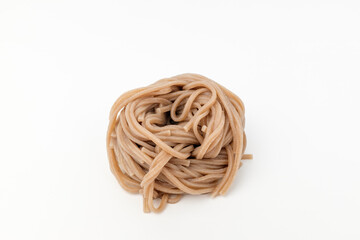 Buckwheat noodles on white background