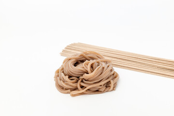 Buckwheat noodles on white background
