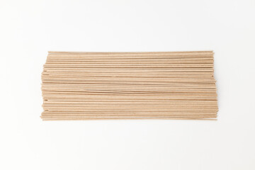 Buckwheat noodles on white background