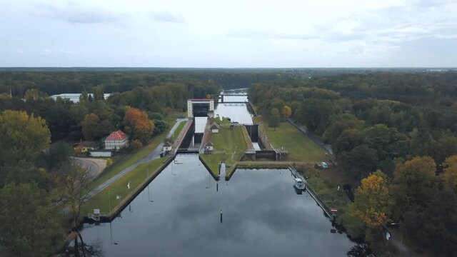 4k aerial footage of a floodgate in a ship canal in Germany