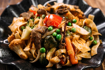 Asian style pasta tagliatelle beef and vegetables