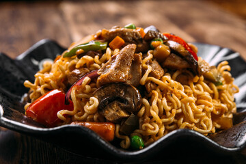 Curly noodles wok chicken mushrooms vegetables