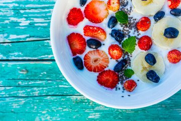 A bowl of delicious yogurt with grains and fresh berry fruit. Weight loss and healthy diet.