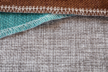 Gray, green and brown textiles. Fabric for decoration, embroidery