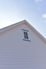 Close-up the window on the attic of the house