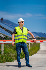 Green energy worker is conducting on-site inspection visit at the new energy base.