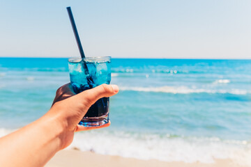 blue cocktail at the beach