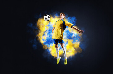Soccer player jumping with ball in smoke