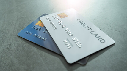 A white and blue credit card on grey background for shopping online or internet banking. Online shopping concept.