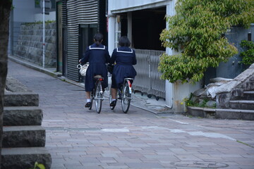 Japanese schoolgirls on their bicycles, Kumamoto, Japan