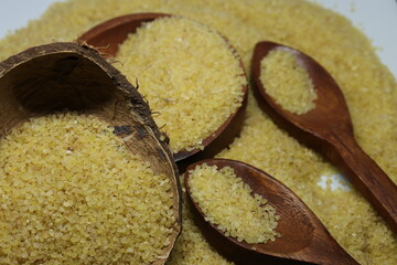 Raw Semolina flour or Rava powder isolated in white background