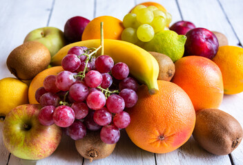 Naklejka na ściany i meble Fresh fruit, orange, banana, grapes and other fruits