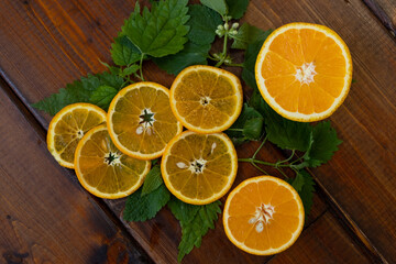 Fototapeta na wymiar orange slices on a brown wooden background, top view, text space, citrus