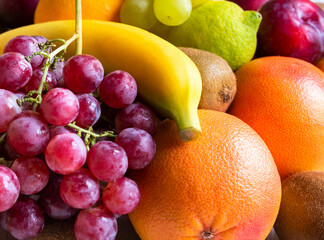 Naklejka na ściany i meble Fresh fruit, orange, banana, grapes and other fruits