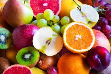 Naklejka na ściany i meble Fresh fruit, orange, apple, kiwi, grapes and other fruits