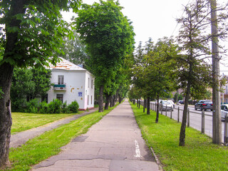 Residential buildings surrounded by greenery on a Sunny summer day