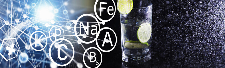 Lime water. Drinking water with fresh lime. Mineral water. Healthy, mineral-rich, refreshing water with lime.